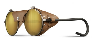 Rund solbrille med læderskærme og fleksible stænger.